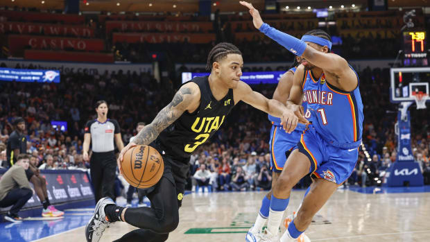 Mar 20, 2024; Oklahoma City, Oklahoma, USA; Utah Jazz guard Keyonte George (3) moves the ball around Oklahoma City Thunder guard Aaron Wiggins (21) during the second half at Paycom Center